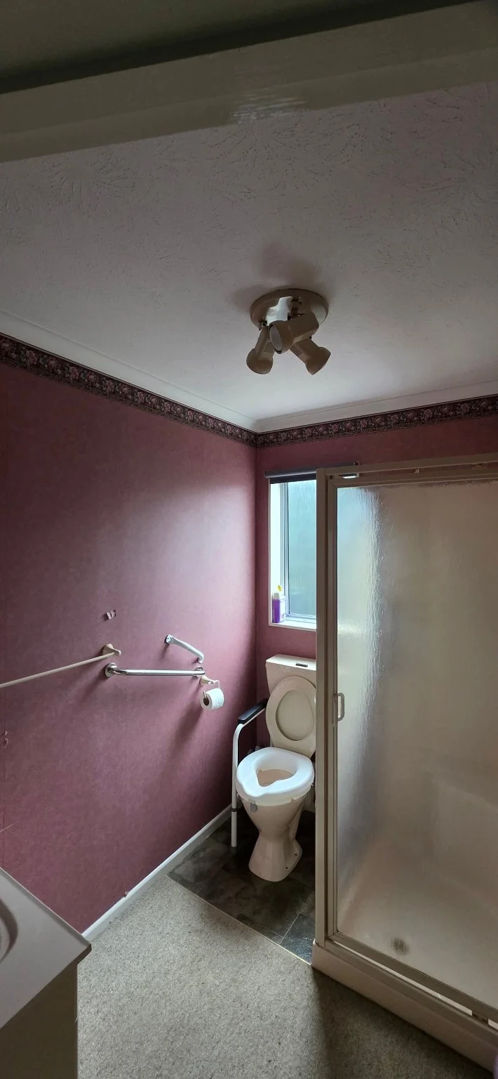 Pink bathroom walls and white ceiling