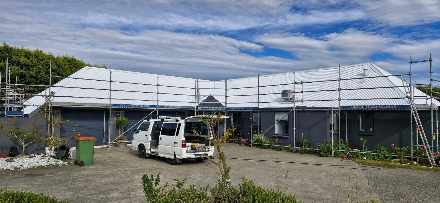 White-coated roof with scaffolding in place