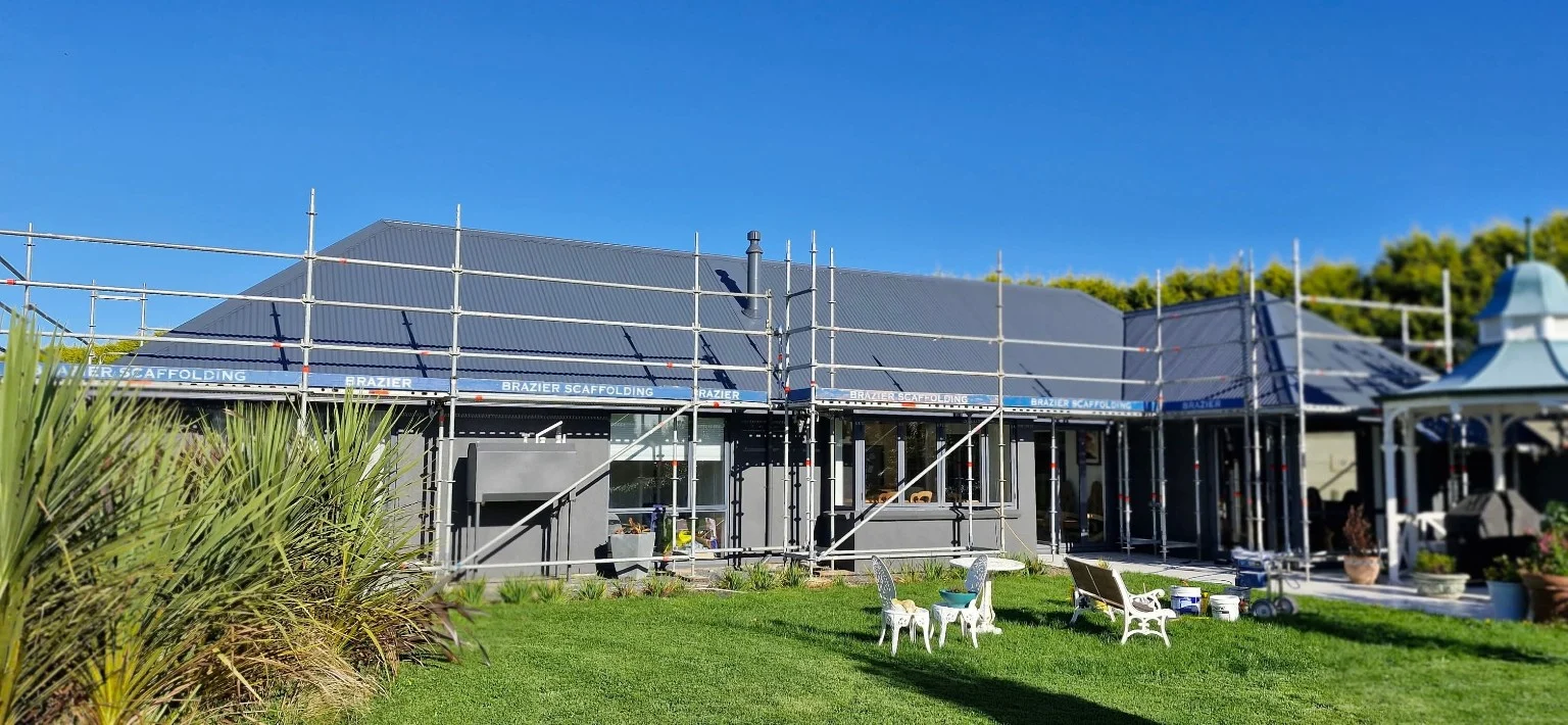 Dark roof and house exterior viewed from the garden